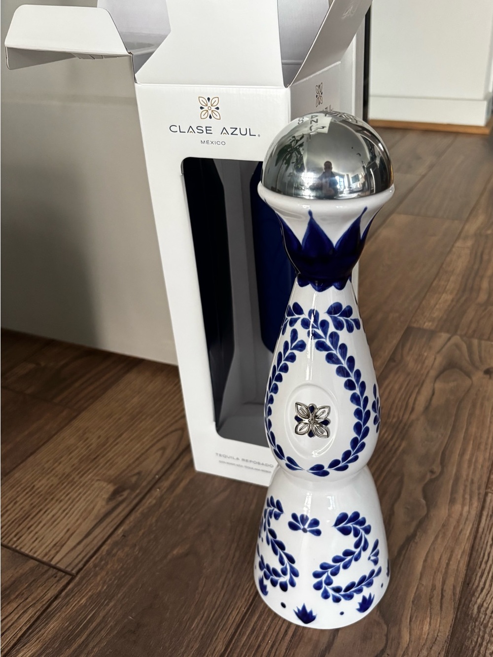 Blue and White Ceramic Decorative Bottle with Silver Accent